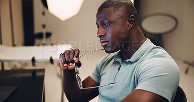 Buy stock photo Photography, editor and thinking with black man in studio for photoshoot, planning and retouching. Vision, production process and reflection with person on set for project, airbrush and media export