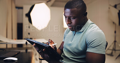 Buy stock photo Black man, photographer and sketch on tablet in studio for production, editing image and retouch. Person, digital and review catalog for picture, website update and backstage with photoshoot results 
