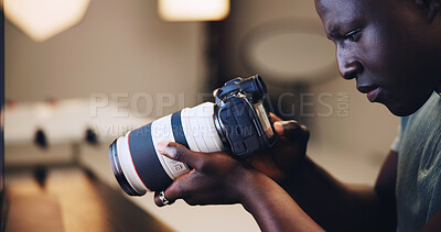 Buy stock photo Camera, photographer and black man in production studio for photoshoot, media or magazine cover. Creative, photography and person behind the scenes with lens for filming or check picture quality