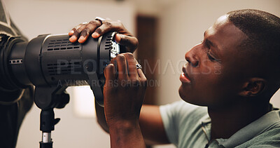 Buy stock photo Photographer, man or lighting setup in studio for photoshoot preparation, production or flashlight. Behind the scenes, photography and black person with equipment setting for spotlight and backstage