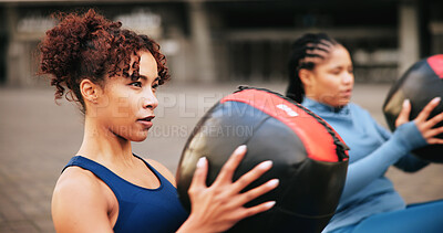 Buy stock photo Workout, medicine ball and teamwork with women in city for challenge, fitness and performance. Health, wellness and commitment with friends outdoor for training partner, exercise club and sports