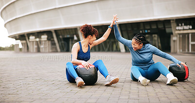 Buy stock photo Fitness, exercise and women with high five in city for strength training, progress and achievement. Ground, friends and celebration with medicine ball for teamwork goals, workout success and support