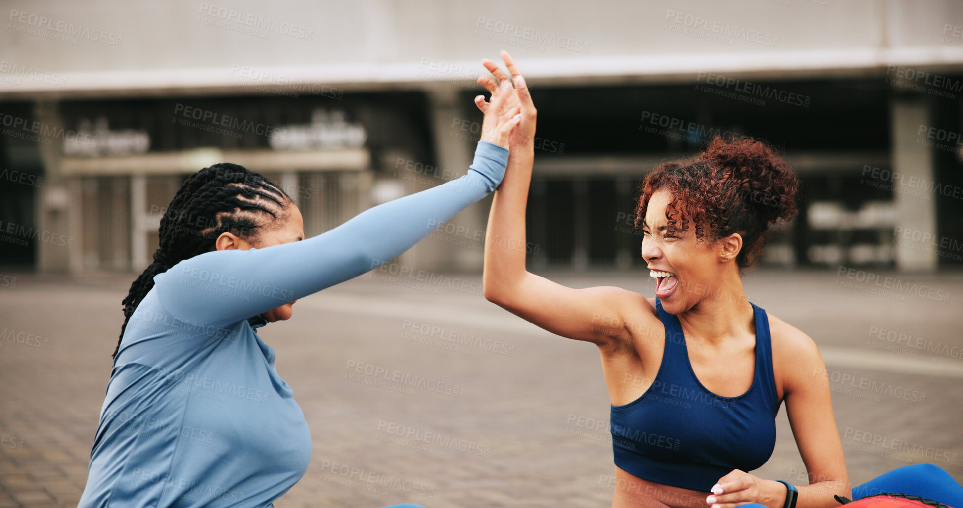 Buy stock photo Fitness, workout and women with high five in city for exercise success, teamwork or performance. Athlete, friends and excited with celebration outdoor for wellness goals, training progress or support