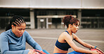 Fitness, leg warm up and women in city with workout or training for wellness, health or activity. Sports, stretching and female athletes with exercise together in urban town for weightloss in morning
