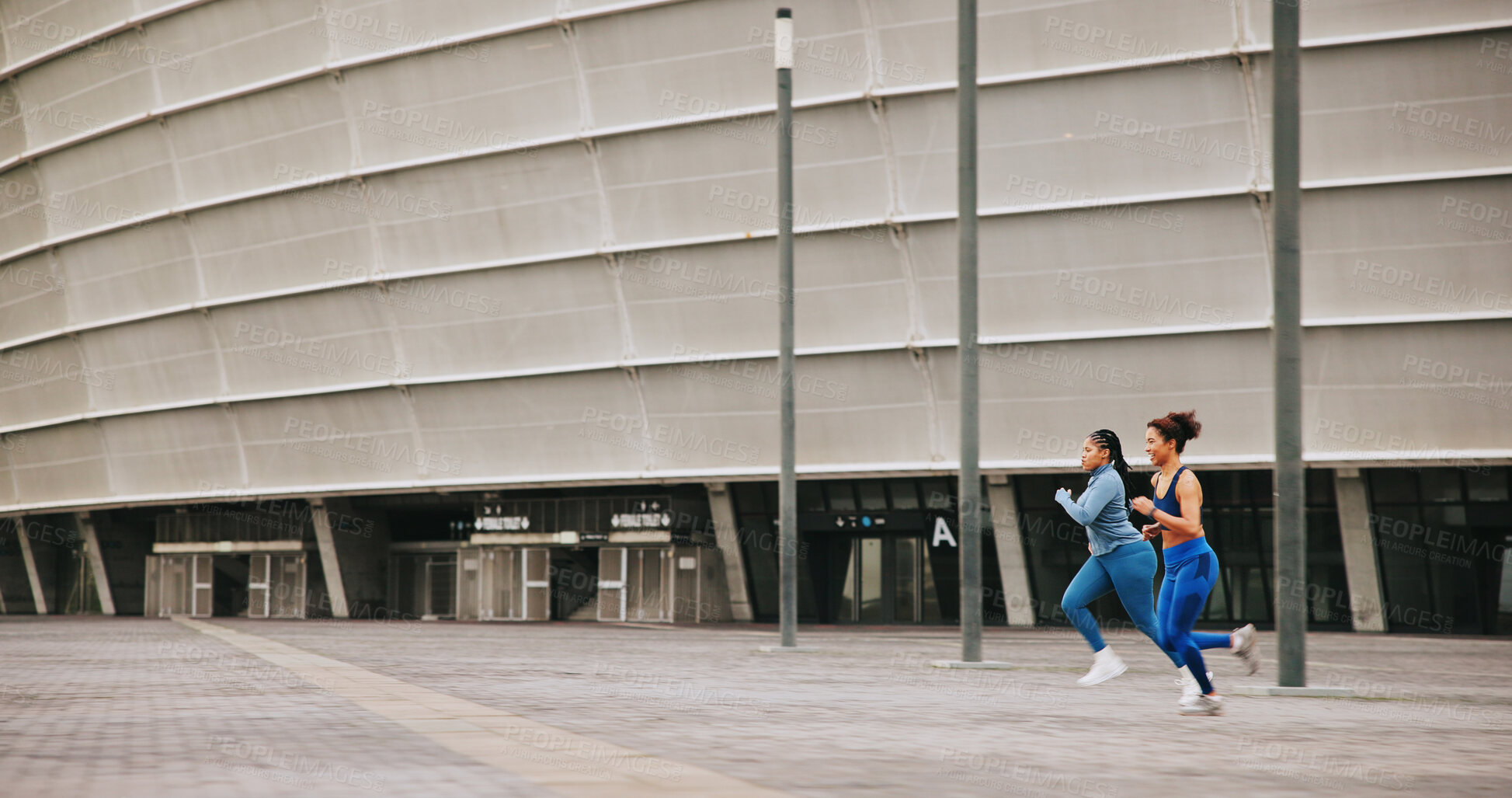 Buy stock photo Running, athlete and women on race, speed and practice for competition, energy or outdoor for sport. Fast, runner or training for marathon in city, African people and exercise for fitness or space