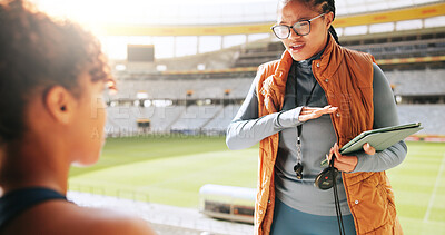 Buy stock photo Women, sports coach and player with motivation, advice or feedback with workout routine. Tablet, personal trainer or professional athlete with practice schedule, planning or outdoor stadium with help