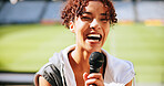 Athlete, mic and laughing in interview at stadium for sports broadcast, funny question and joke. Public relations, television or woman speaking at press conference for game feedback or fan engagement