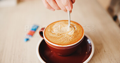 Buy stock photo Table, hands and stir cappuccino in restaurant for caffeine, prepare beverage and warm drink. Above, person and mixing sugar in cafe for coffee sweetener, espresso break and routine to enhance flavor