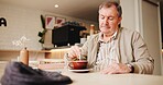 Senior man, relax and coffee at cafe for calm morning, breakfast espresso and retirement break. Thinking, elderly person and stir beverage for lonely reflection, nostalgia memory and holiday wellness