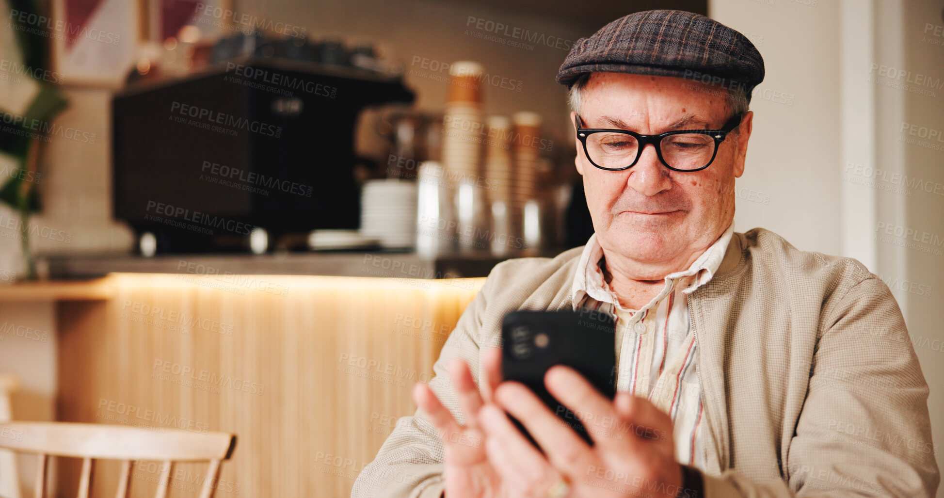 Buy stock photo Break, glasses and phone with old man in coffee shop to relax for retirement, service or wellness. Communication, eyewear and hat with happy senior customer browsing app in cafe or restaurant