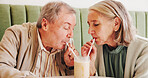 Milkshake, straw or senior couple in cafe with love, drinks or drink for romance, date or anniversary. Retirement, smile or people in romantic relationship for smoothie, break or support in diner