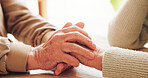 Holding hands, bonding and senior couple in home with comfort, support or connection in relationship. Empathy, trust and elderly man with woman for care, love and romance in marriage in house.