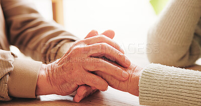 Buy stock photo Holding hands, bonding and senior couple in home with comfort, support or connection in relationship. Empathy, trust and elderly man with woman for care, love and romance in marriage in house.