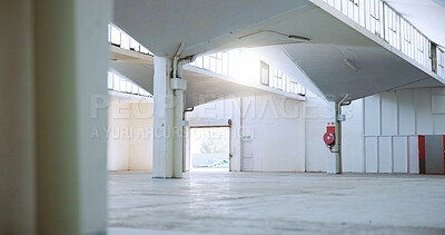 Buy stock photo Building, industrial architecture and empty space with interior design for shelter or structure. Entrance, walls and pillars of concrete construction with fire exit for security and safety measure