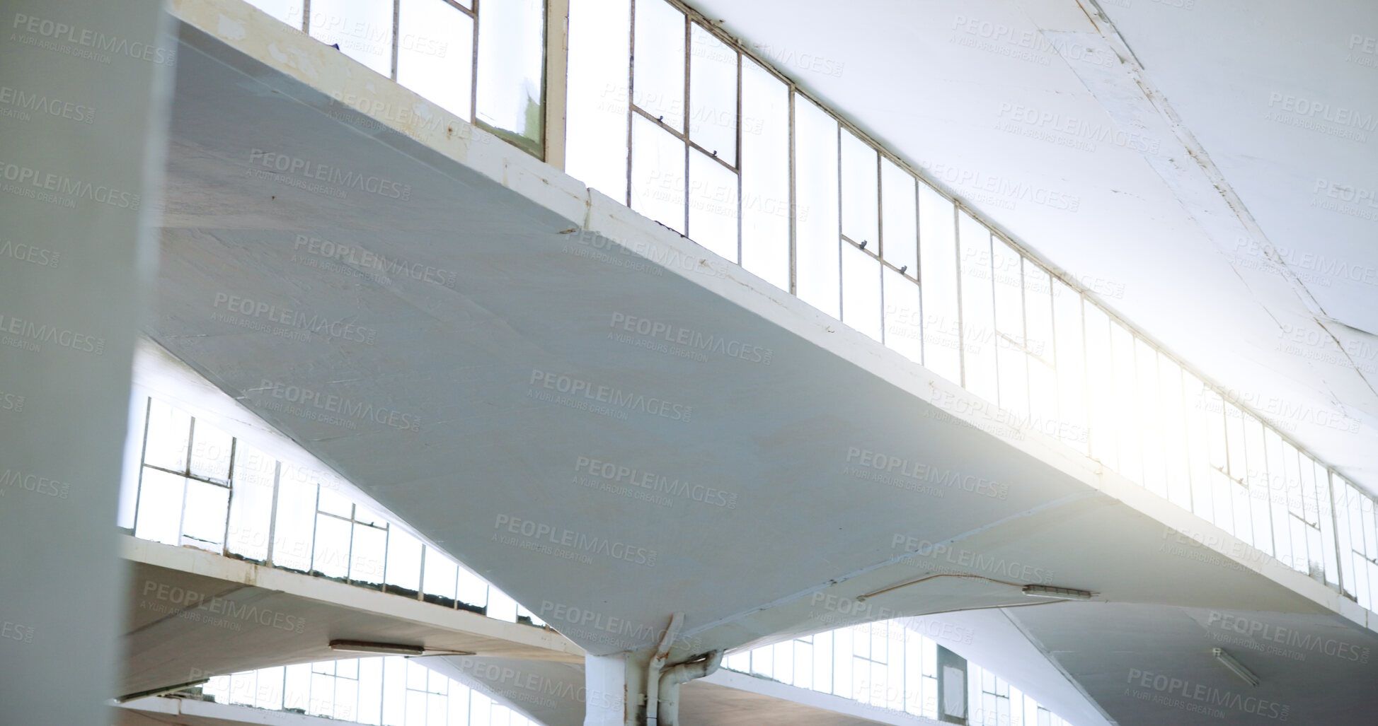 Buy stock photo Warehouse, industrial architecture and empty building with interior design for shelter or structure. Workshop, walls and pilars of concrete construction with solid infrastructure or development