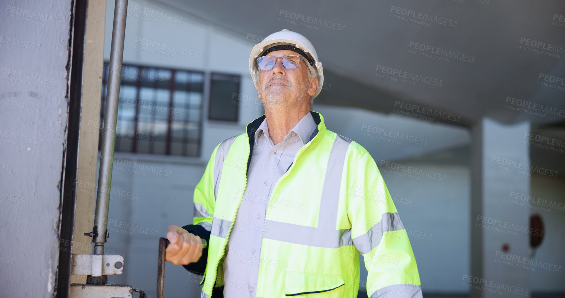 Buy stock photo Mature man, garage door and open for logistics, stock or storage at warehouse for supply chain. Person, engineer and inspection with maintenance, check or commercial distribution at industrial plant