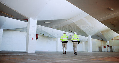 Buy stock photo Men, architect and inspection with point at warehouse, talk and review for design at plant. People, mentor and engineer with safety check for planning, expansion and feedback at construction site