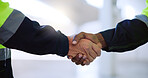 Construction, hands and men with handshake on site for building partnership, new project and deal. Engineering, contractors and agreement in warehouse for b2b collaboration, negotiation and planning