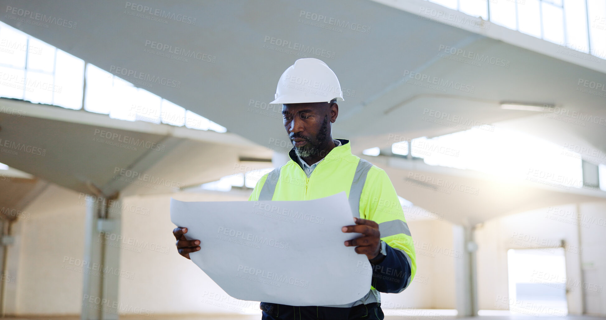 Buy stock photo Construction, blueprint and black man in building thinking for inspection, project ideas and planning. Engineering, industrial site and person with documents for floorplan, infrastructure and layout