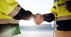 Construction, hands or people with handshake on site for building partnership, new project or deal. Engineering, contractors and agreement in warehouse for quality control, safety inspection or flare