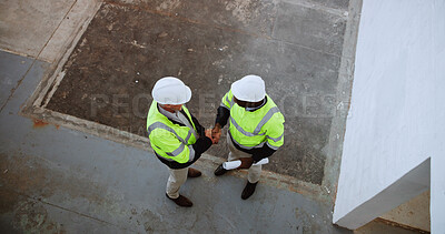 Buy stock photo Above, construction and men with handshake on site for building collaboration, new project or deal. Engineering, contractors and shaking hands with agreement for quality control and safety inspection