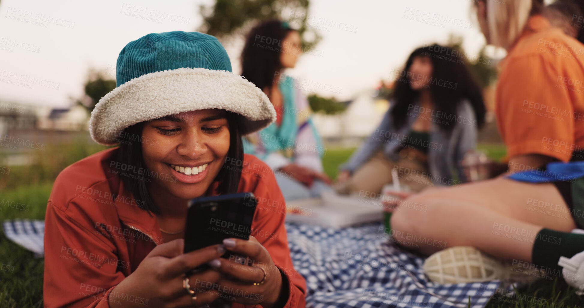 Buy stock photo Texting, woman and smartphone on picnic, social media or communication with contact on app or smile. Friends, reunion and happy with chat on website, people and message with mobile, outdoor or typing