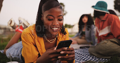 Buy stock photo Texting, woman and smartphone on picnic, outdoor or smile for communication with contact and online. Friends, reunion and happy with chat on website, people and message with mobile, digital or typing