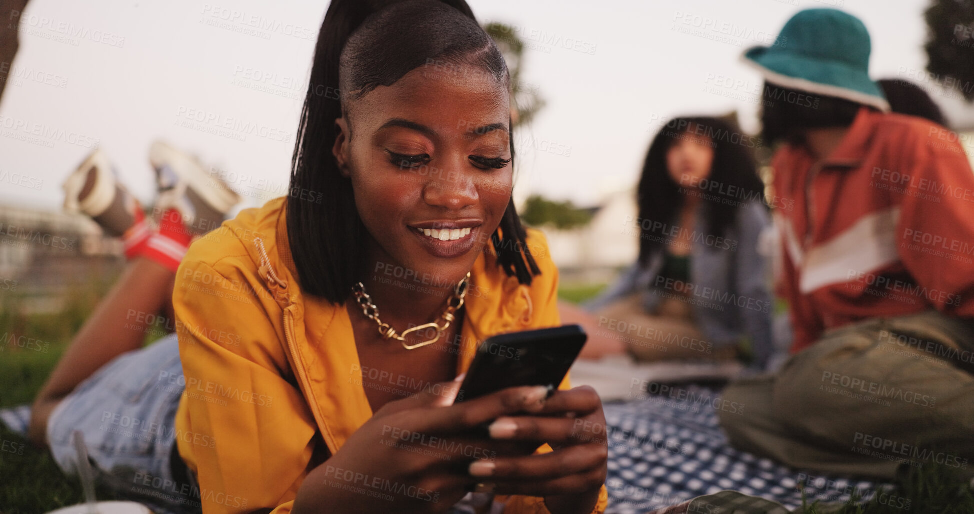 Buy stock photo Texting, woman and smartphone on picnic, outdoor or smile for communication with contact and online. Friends, reunion and happy with chat on website, people and message with mobile, digital or typing