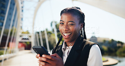 Buy stock photo Businesswoman, phone and wink in portrait, city or smile for chat, playful or post on commute to work. African person, smartphone and flirt in town on bridge, online dating and mobile app in Kenya