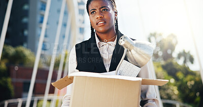 Buy stock photo Frustrated, black woman or fired with box in city for job loss, retrenchment or work termination. Female person, unemployment and carrying equipment for layoff or economic recession in an urban town