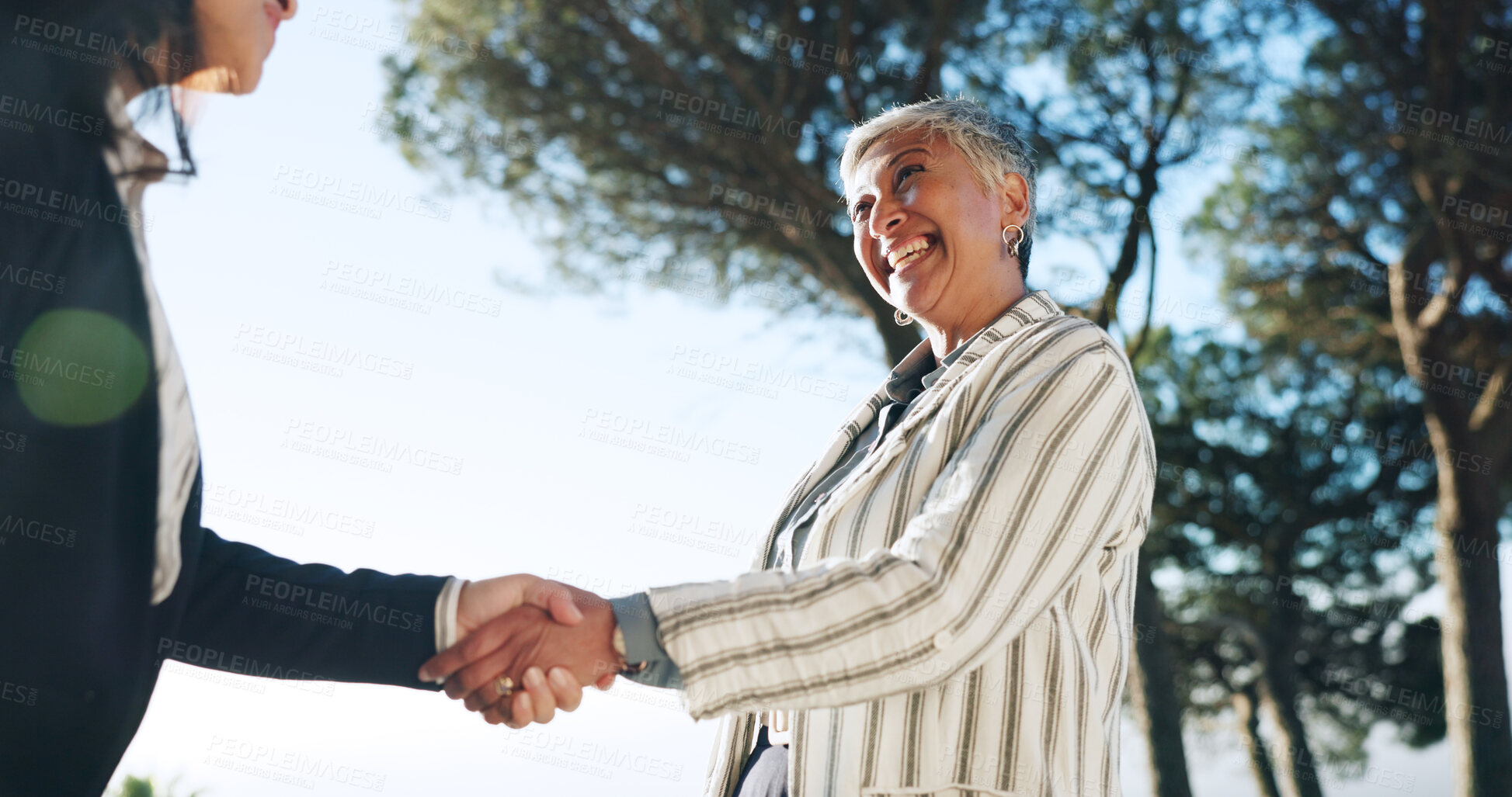 Buy stock photo Deal, handshake and meeting with business people outdoor for bonus, goals or target from below. Agreement, thank you and welcome with employee team shaking hands in park for achievement or promotion