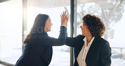 Buy stock photo Business women, high five and happy at office with success, goals and achievement at legal agency. Lawyer, team and partner with celebration, thanks and promotion by window at corporate law firm