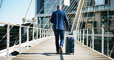 Buy stock photo Back view, businessman and travel with suitcase in city for corporate trip or journey on bridge. Man, traveler or walking with luggage for urban business, new career or job opportunity downtown