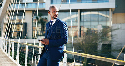 Buy stock photo Bridge, phone and black businessman in city for thinking, networking and online connection. Corporate, professional and entrepreneur with mobile app for website, internet news and ideas in urban town