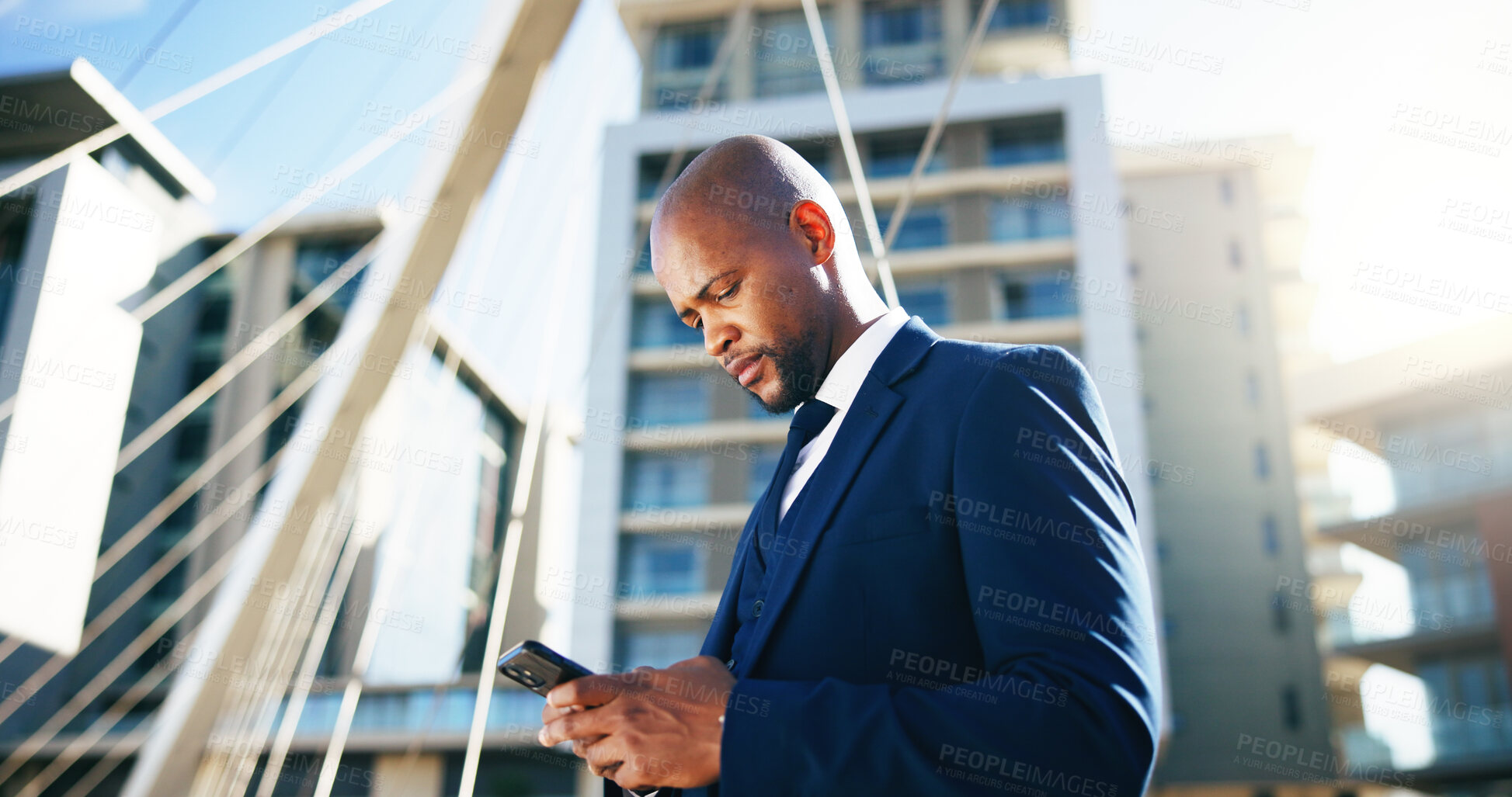 Buy stock photo Corporate, phone and business black man in city for networking, contact and online connection. Reading, professional and person typing on smartphone for website, internet news and email in urban town