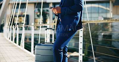 Buy stock photo Outdoor, person and texting on smartphone, business trip or waiting for taxi on urban street or app. Message, cab and employee with mobile for communication, typing and suitcase in city and road