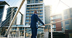 Back, business and black man in city, bridge and contemplation with buildings. Person, outdoor and employee with urban town, investor and real estate with pride, formal and travel with property owner