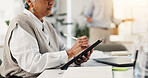Business, mature woman and tablet in office for research, schedule update and post article. Female journalist, digital and typing for draft feedback, proofreading story and information on publication