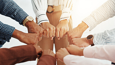 Buy stock photo Business people, huddle and fist in circle with support, collaboration or team building. United, staff mission or group of employees with hands in office for synergy, meeting or solidarity together