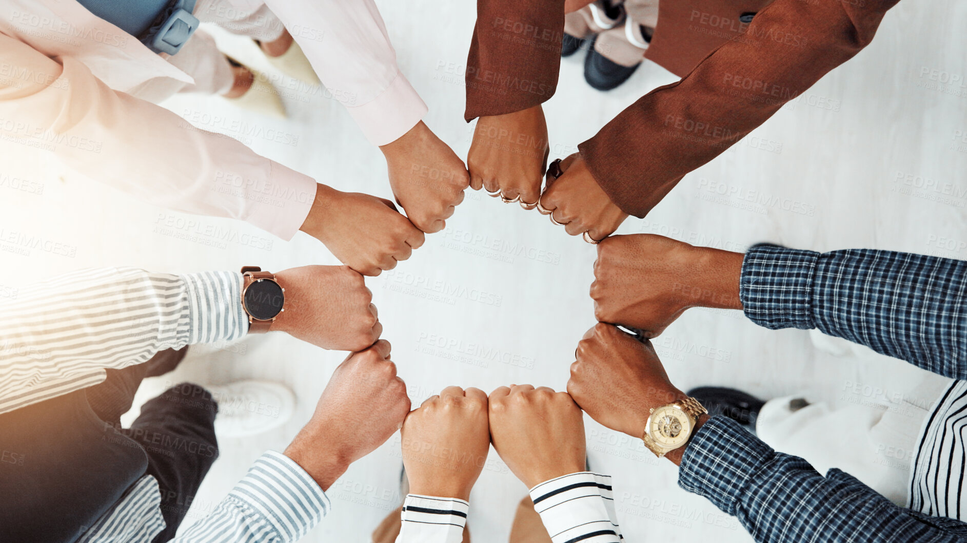Buy stock photo Business people, above and fist in circle with support, collaboration or team building. United, staff mission or group of employees with hands in office for synergy, meeting or solidarity together