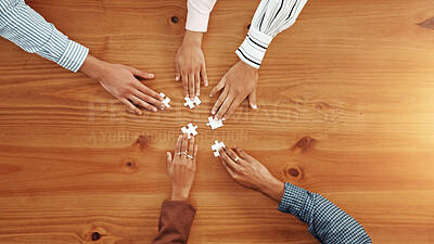 Buy stock photo Hands, puzzle and business people in office for partnership, solution or collaboration in meeting. Jigsaw, top view and corporate employees with synergy, problem solving or team building in workplace