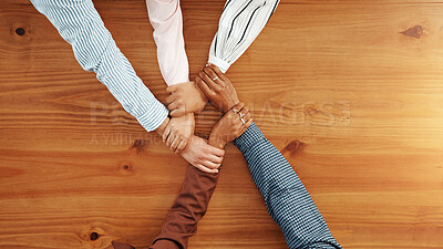 Buy stock photo Unity, colleagues and people in office, holding hands and link for corporate company and connection. Above, together and collaboration of group for business growth, space and support for synergy