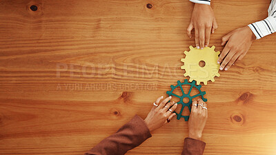 Buy stock photo People, hands and cogs with gears above for team building or problem solving on wooden table. Top view, employees or creative colleagues with cognitive wheels for critical thinking on mockup space