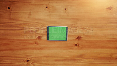 Buy stock photo Empty, tablet screen and wooden table above with space for advertising or marketing app. Top view, technology or chromakey display with mockup for UI, UX or online template on a timber background