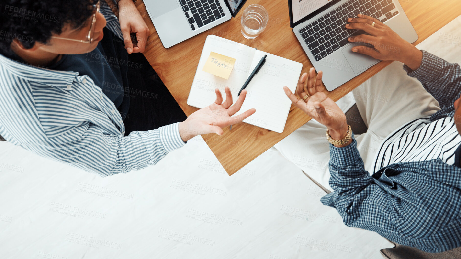 Buy stock photo Teamwork, laptop and notebook with business people in office for meeting, schedule or task update. Budget report, project progress and collaboration with above of employees for review and planning