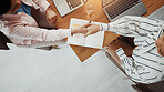 Business people, meeting or above with handshake for deal, introduction or partnership in office. Top view, employees or colleagues shaking hands with laptop or book for b2b or agreement in workplace