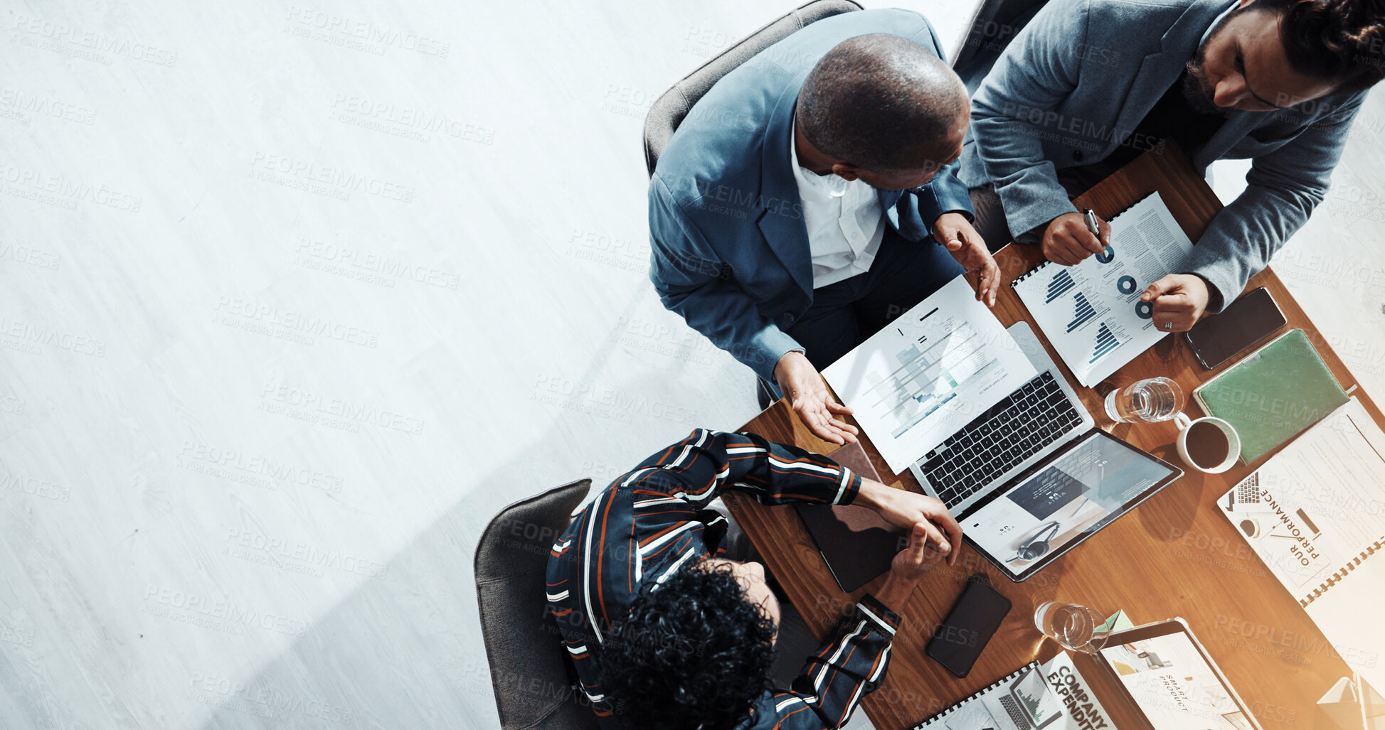 Buy stock photo Business people, meeting and above with documents, financial review, discussion and graphs at office. Men, women and paperwork with laptop, charts and space with feedback for revenue stats at company