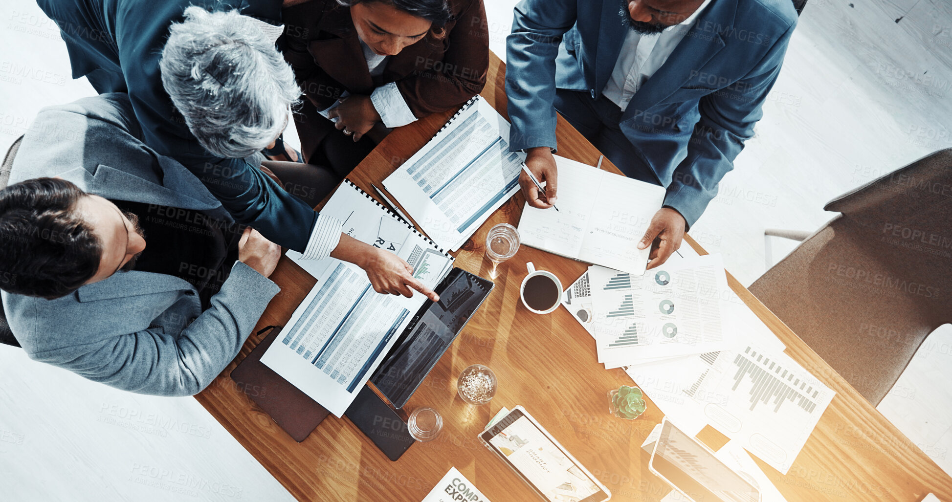 Buy stock photo Documents, laptop and planning with business people in meeting for expenditure report, budget and review. Teamwork, project capital and revenue paperwork with above of employees for digital invoice