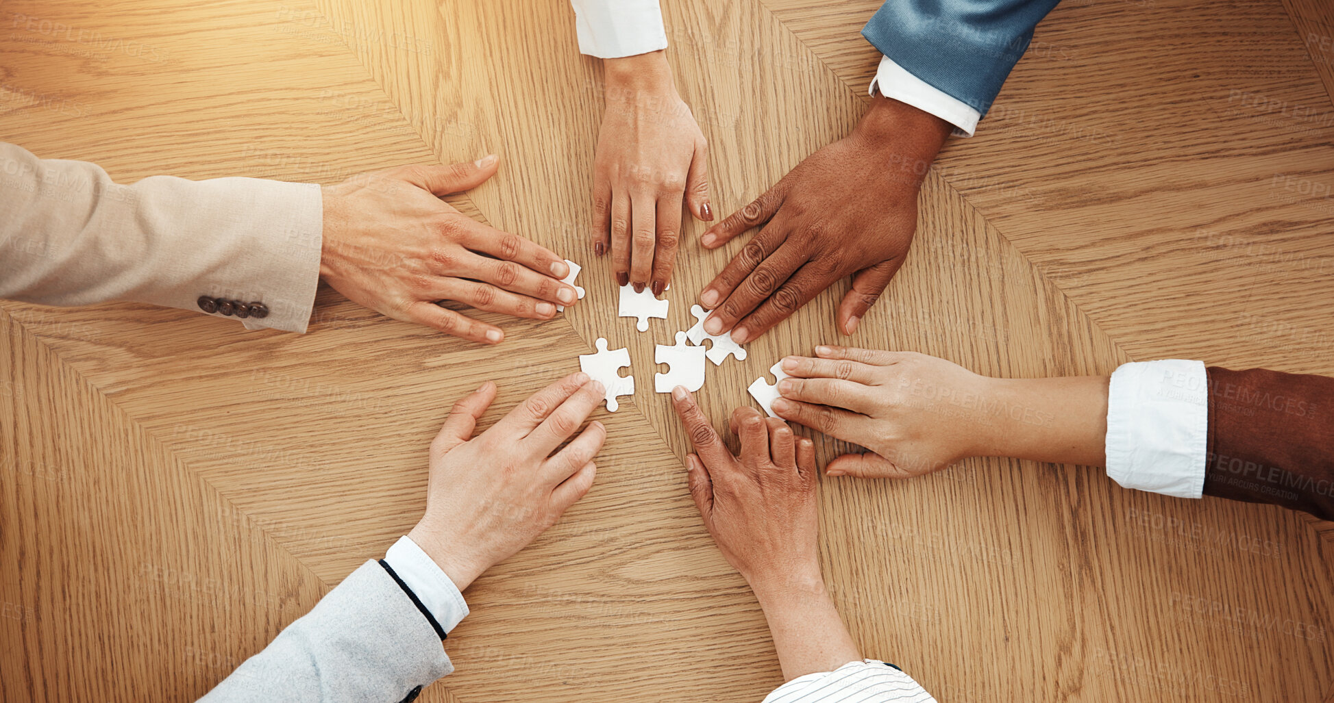 Buy stock photo Hands, above and puzzle for team at office with solution, synergy and strategy for game at company. Group, jigsaw and problem solving with integration, challenge and collaboration at insurance agency