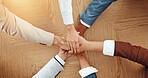 `Teamwork, desk and hands of business people in office for solidarity, agreement and partnership. Professional, corporate and workers with stack for collaboration, support and coworking synergy